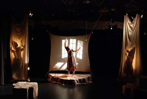 Photo of Nina J. Silver surrounded by puppeteer shadows